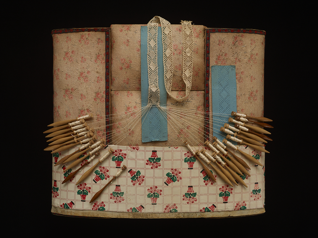 Bobbinlace pillow with thirty bobbins and inprogress torchon lace